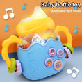 Load image into Gallery viewer, Montessori Baby Musical Feeding Bottle Toys Infant Grip Training Music
